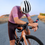 Cyclist taking a RocketFuel RACE gel on the road
