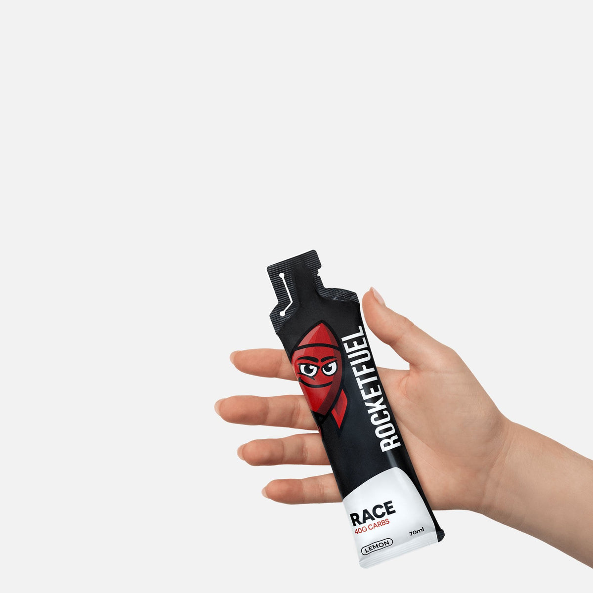 Hand holding a RACE energy gel
