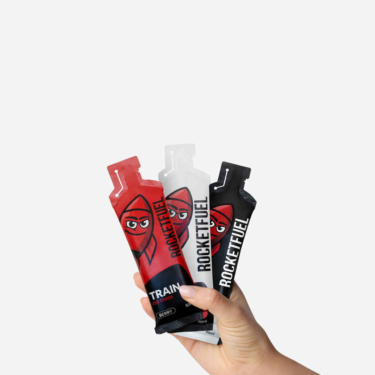 Hand holding TRAIN, RACE+ and RACE gels