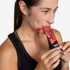 Athlete taking a RocketFuel TRAIN gel