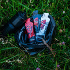 TRAIN, RACE and RACE+ gels in a cycling helmet in the grass